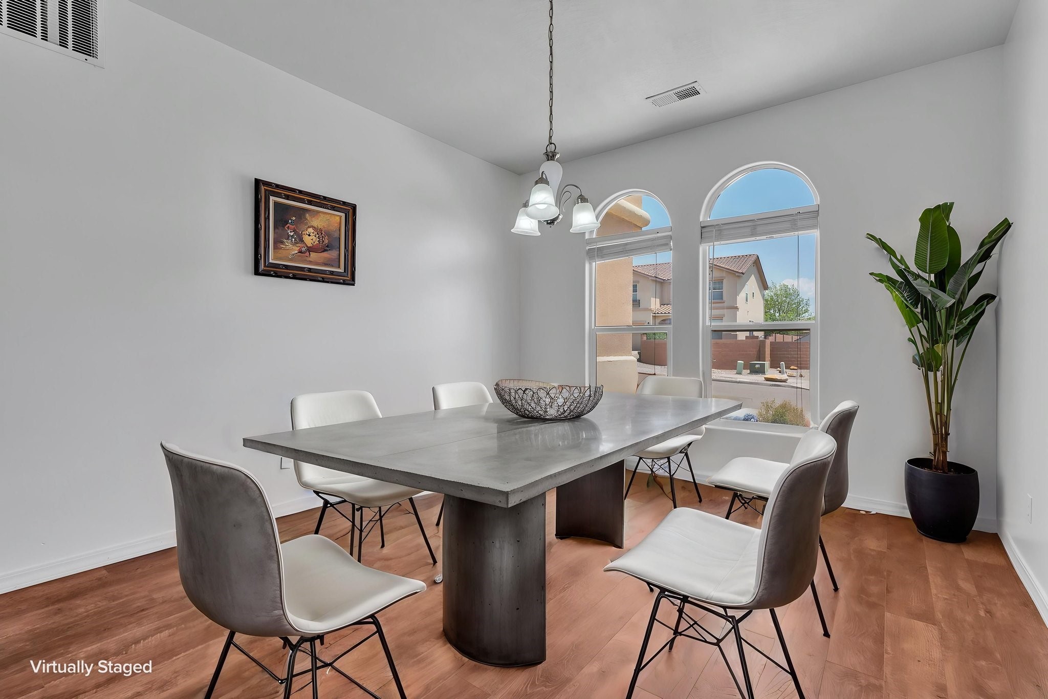 6914 Wrangell Loop Northeast Rio Rancho, NM 87144 - Photo 12 of 61 Dining Room Looking out from the Kitchen - Virtually Staged