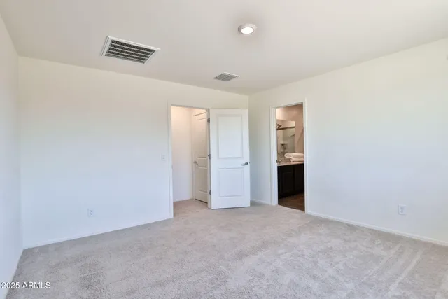 a bathroom with a granite countertop sink a mirror and a shower