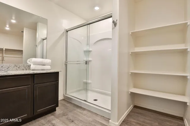 a bathroom with a glass shower door