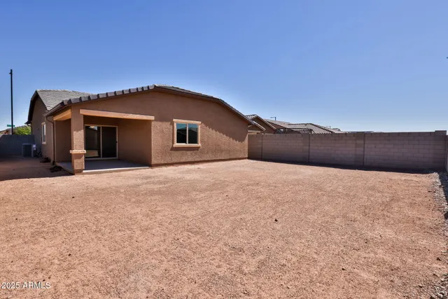 a house with yard in front of it