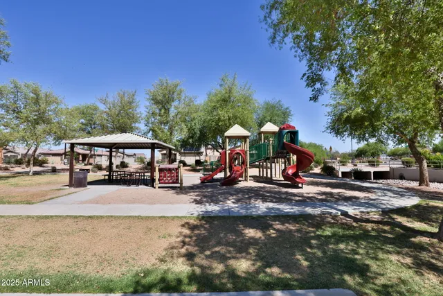 an aerial view of residential building and lake