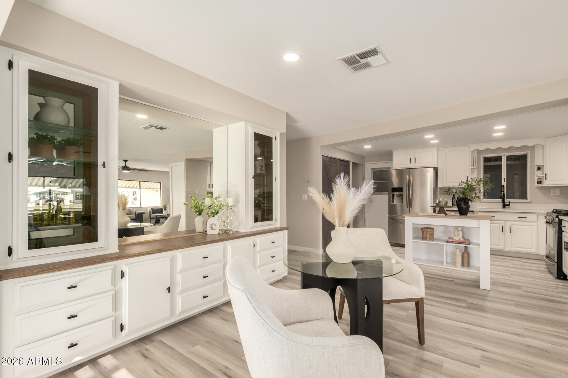 422 South 80th Way Mesa, AZ 85208 - Photo 11 of 28 a view of a dining room with furniture and wooden floor
