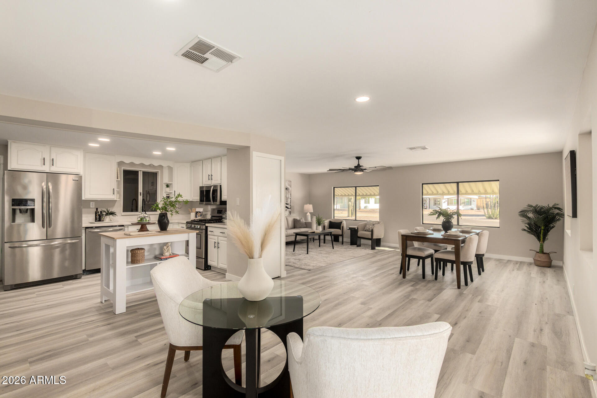 422 South 80th Way Mesa, AZ 85208 - Photo 12 of 28 a view of a dining room with furniture and wooden floor