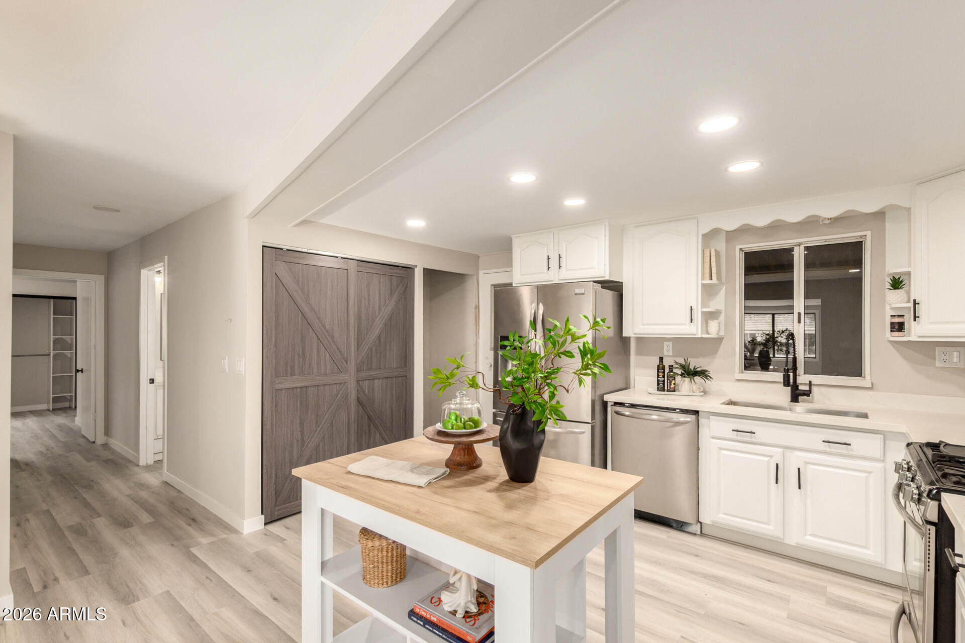 422 South 80th Way Mesa, AZ 85208 - Photo 13 of 28 a kitchen with a sink stove and cabinets