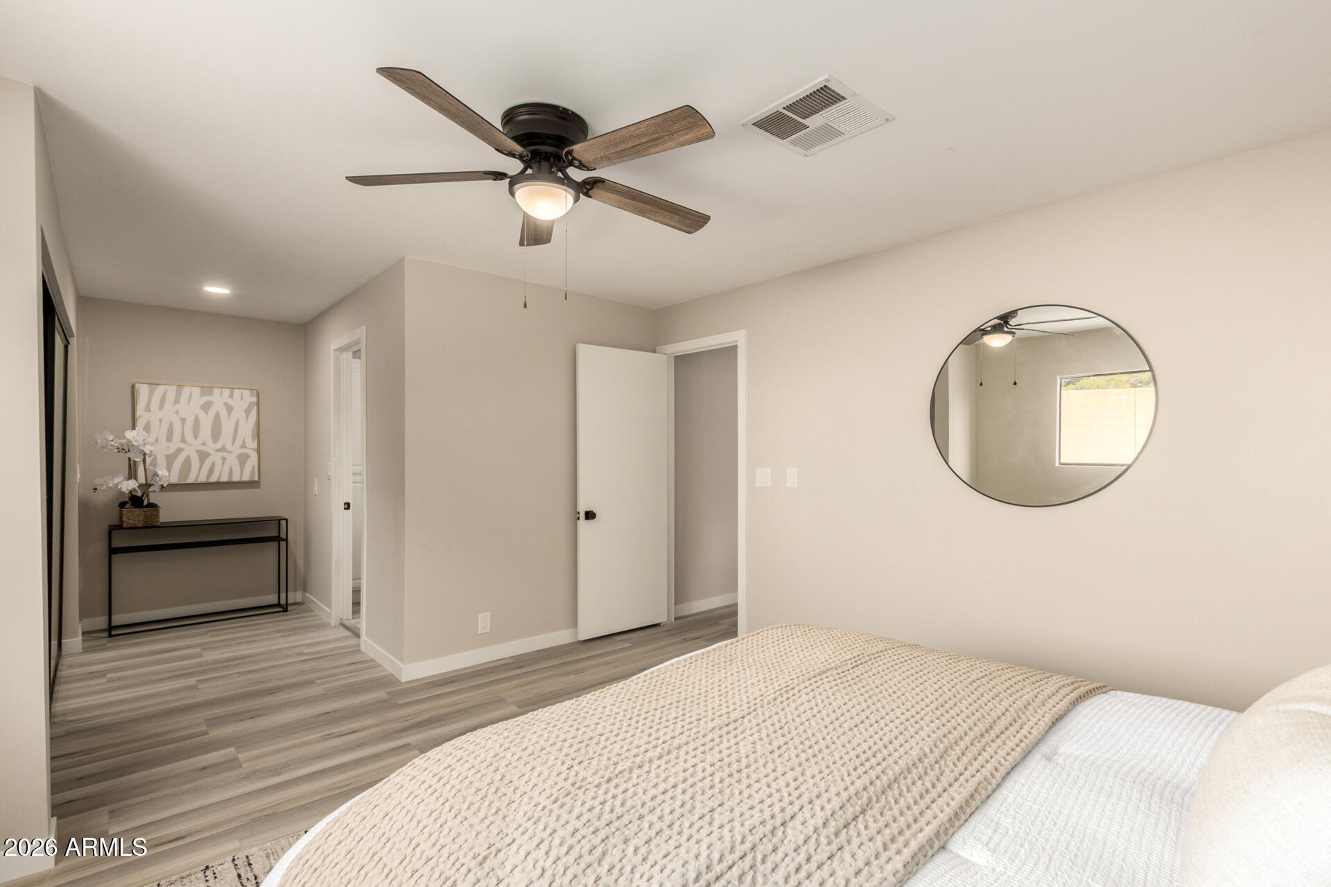 422 South 80th Way Mesa, AZ 85208 - Photo 18 of 28 a bedroom with a bed and a mirror