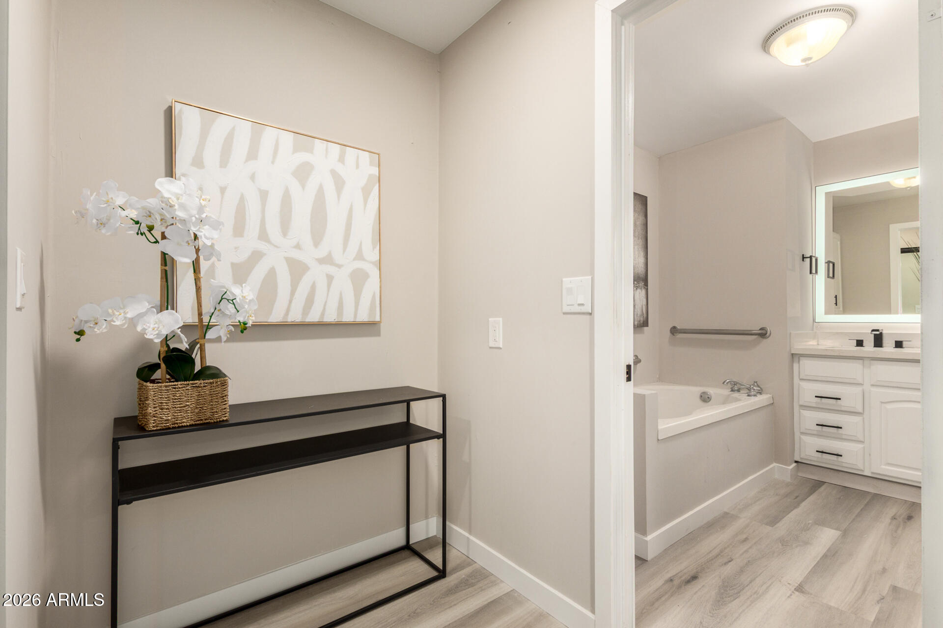 422 South 80th Way Mesa, AZ 85208 - Photo 19 of 28 a kitchen with white cabinets and sink