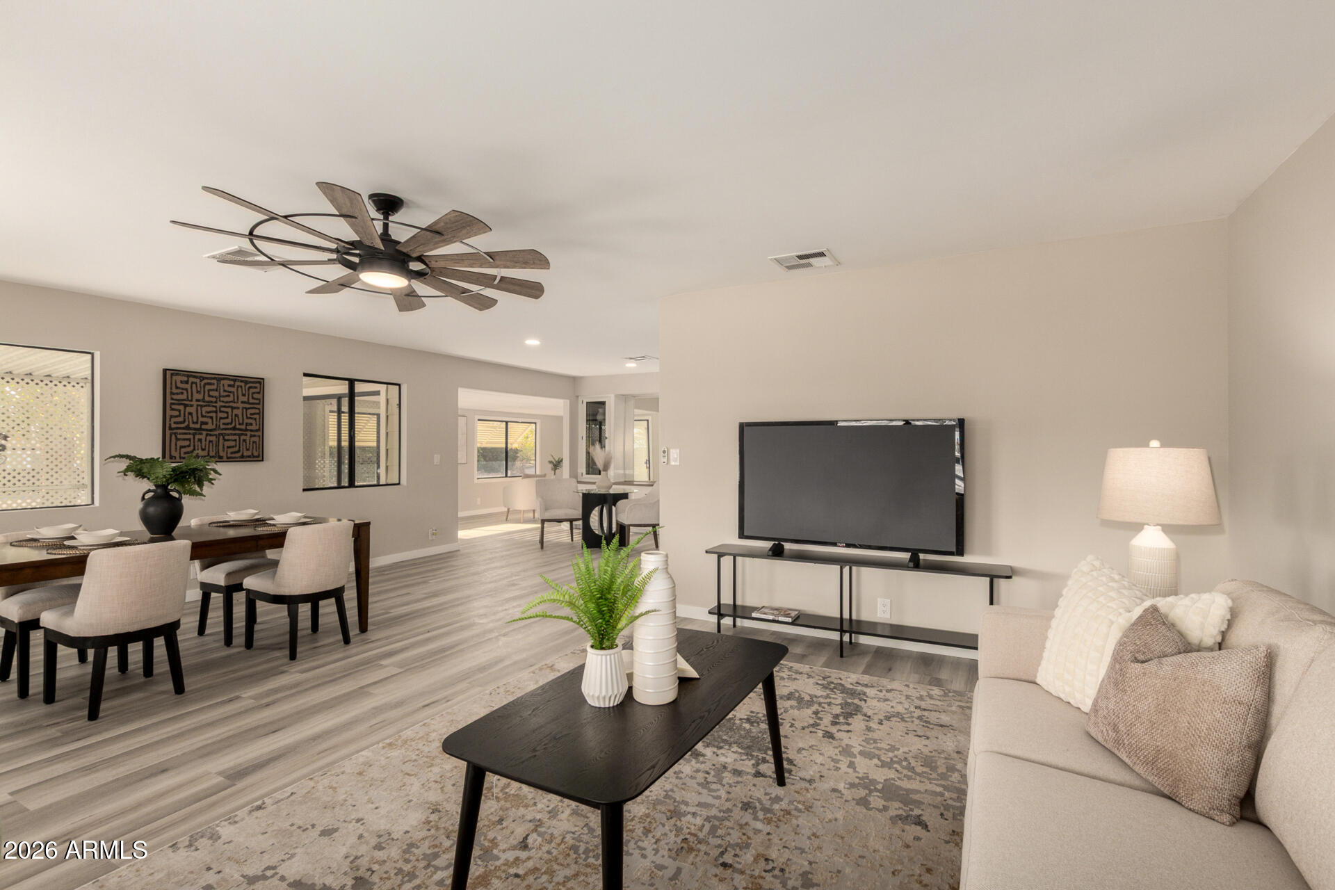 422 South 80th Way Mesa, AZ 85208 - Photo 4 of 28 a living room with furniture and a flat screen tv