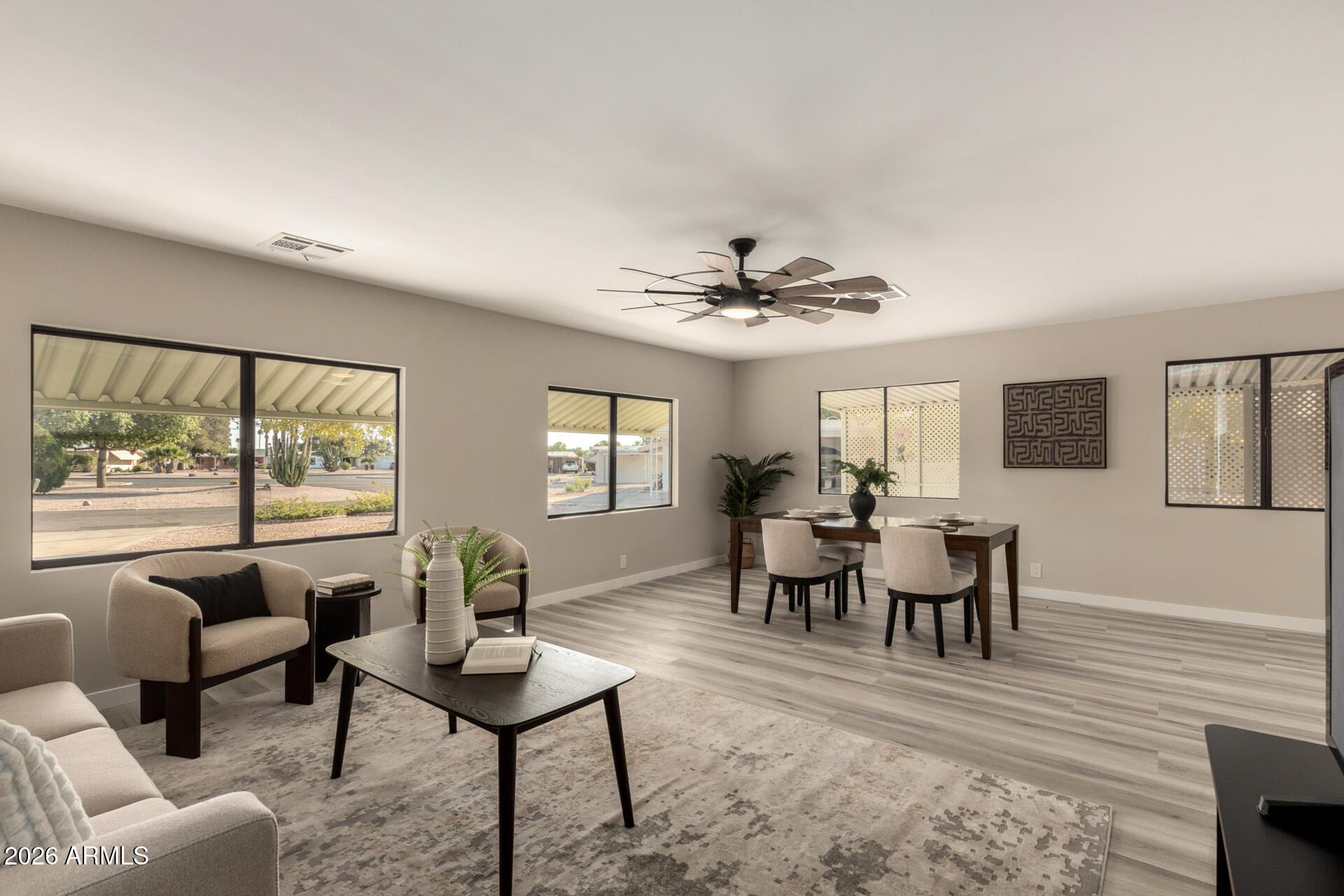 422 South 80th Way Mesa, AZ 85208 - Photo 5 of 28 a living room with furniture and a large window