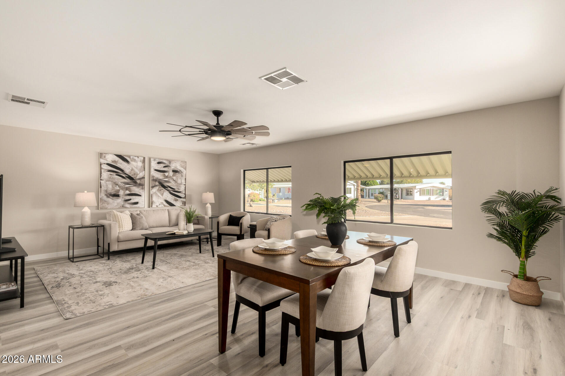 422 South 80th Way Mesa, AZ 85208 - Photo 6 of 28 a view of a dining room with furniture window and wooden floor