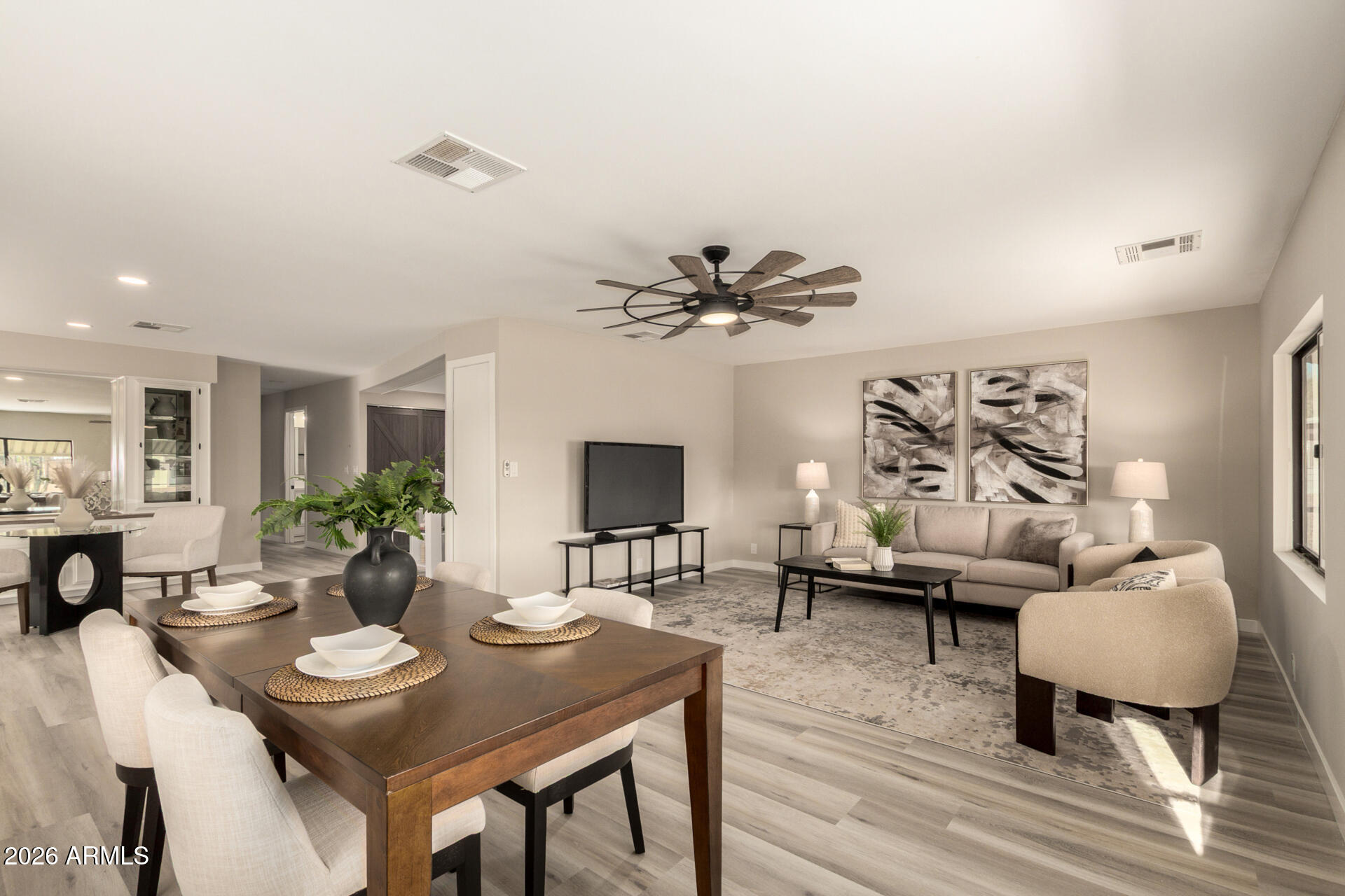 422 South 80th Way Mesa, AZ 85208 - Photo 7 of 28 a view of a dining room with furniture and wooden floor