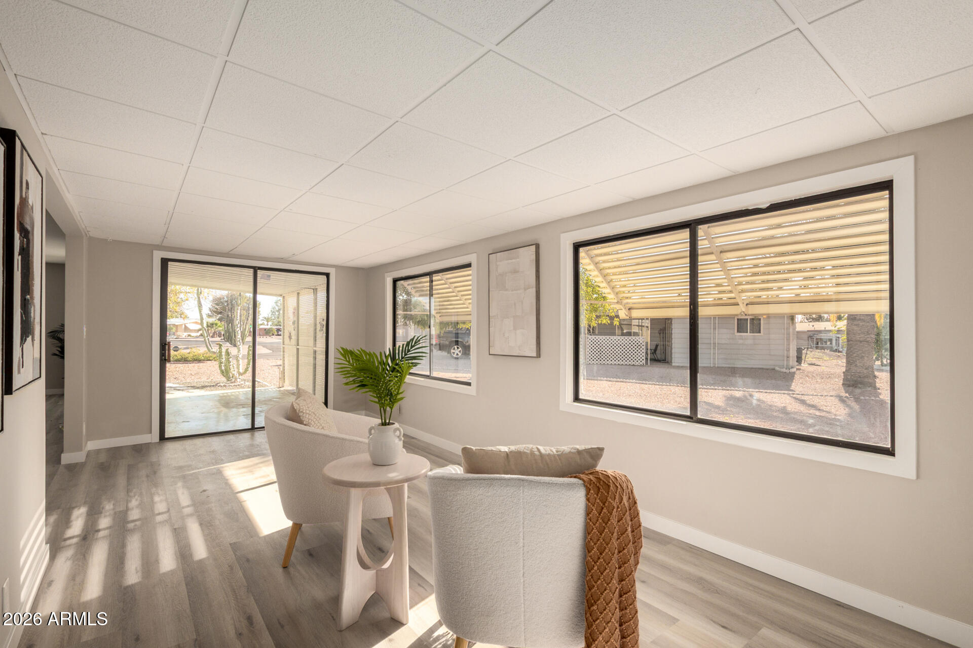 422 South 80th Way Mesa, AZ 85208 - Photo 9 of 28 a living room with furniture and floor to ceiling windows