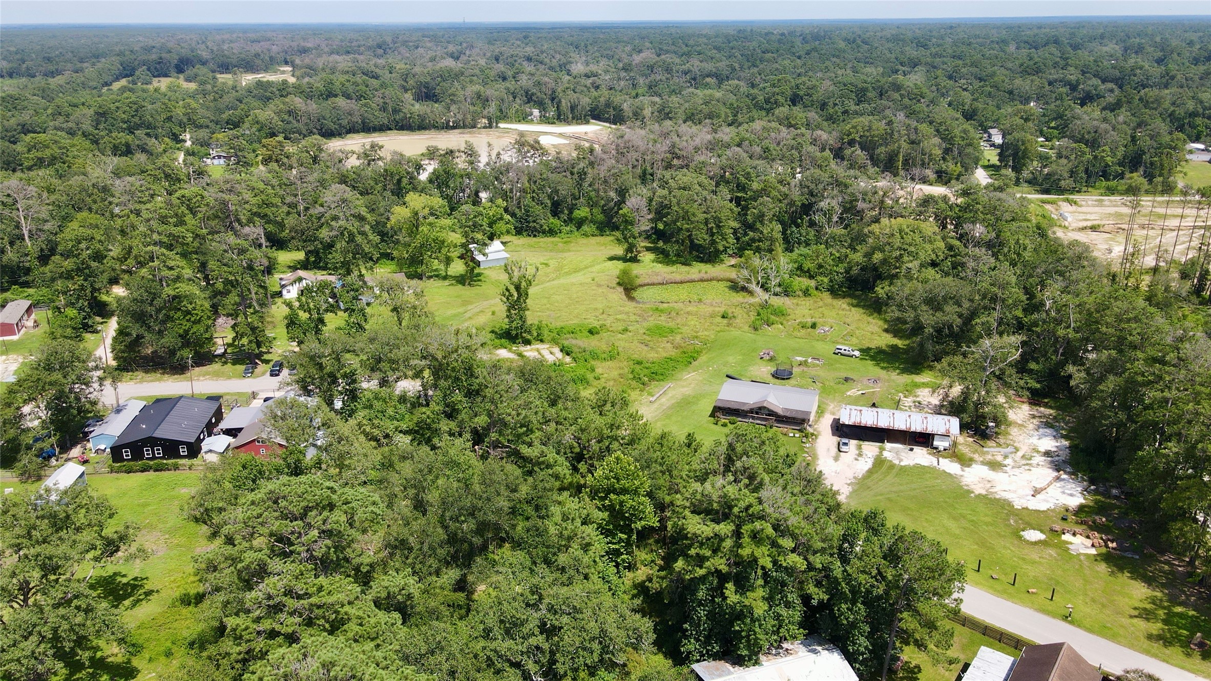 17138 Hl Patton Boulevard Splendora, TX 77372 - Photo 5 of 8 an aerial view of a house with a yard