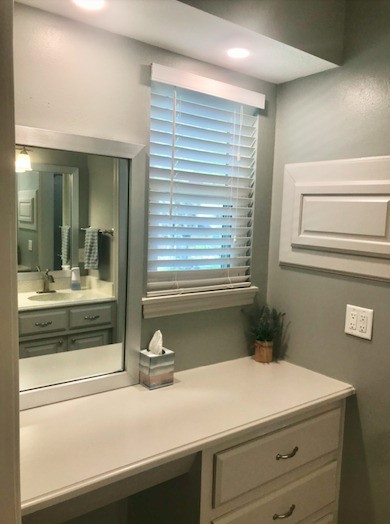 5219 Glenmere Lane Spring, TX 77379 - Photo 20 of 36 a bathroom with a sink and a mirror