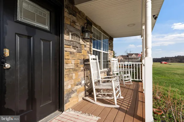 a view of a patio with a table and chairs