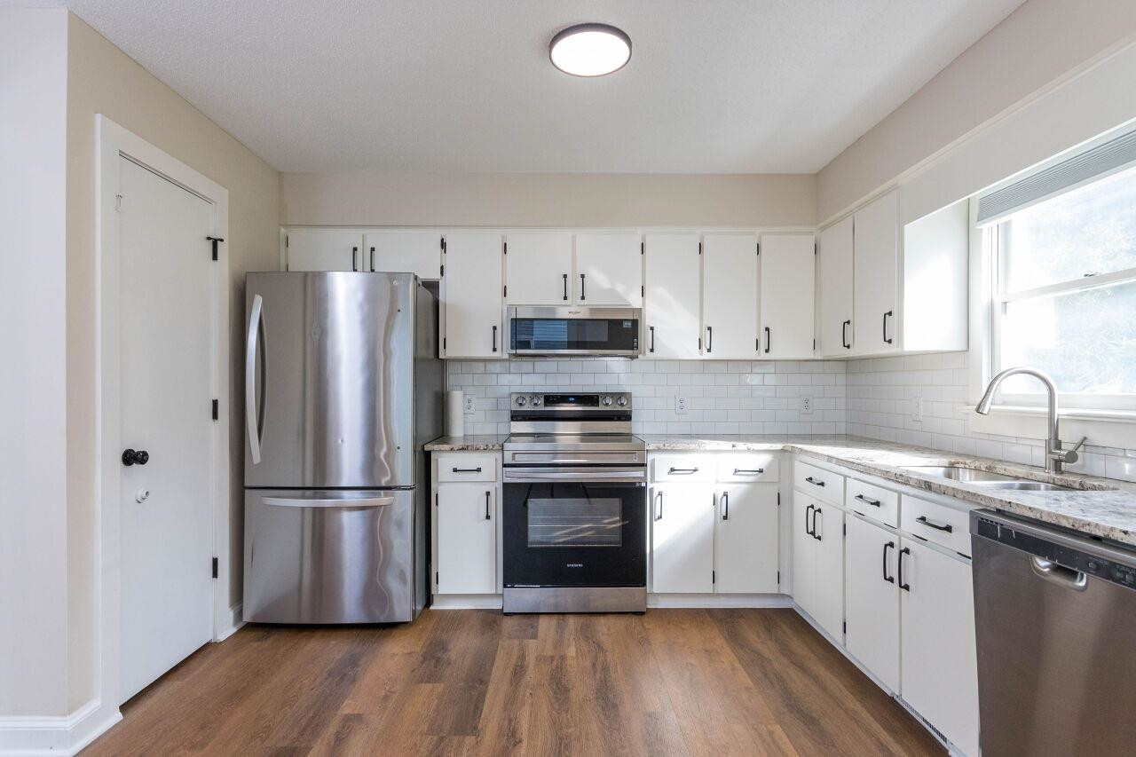 7305 Wilderness Road Raleigh, NC 27613 - Photo 7 of 27 Kitchen with SS Appliances