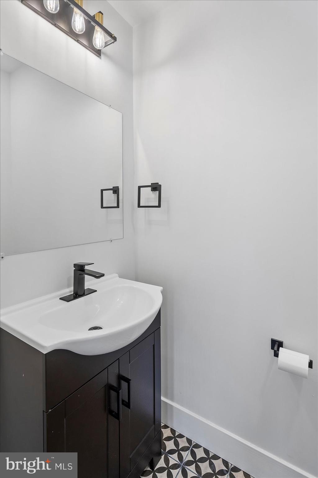11030 Bird River Grove Road White Marsh, MD 21162 - Photo 23 of 53 a bathroom with a sink a vanity and a toilet