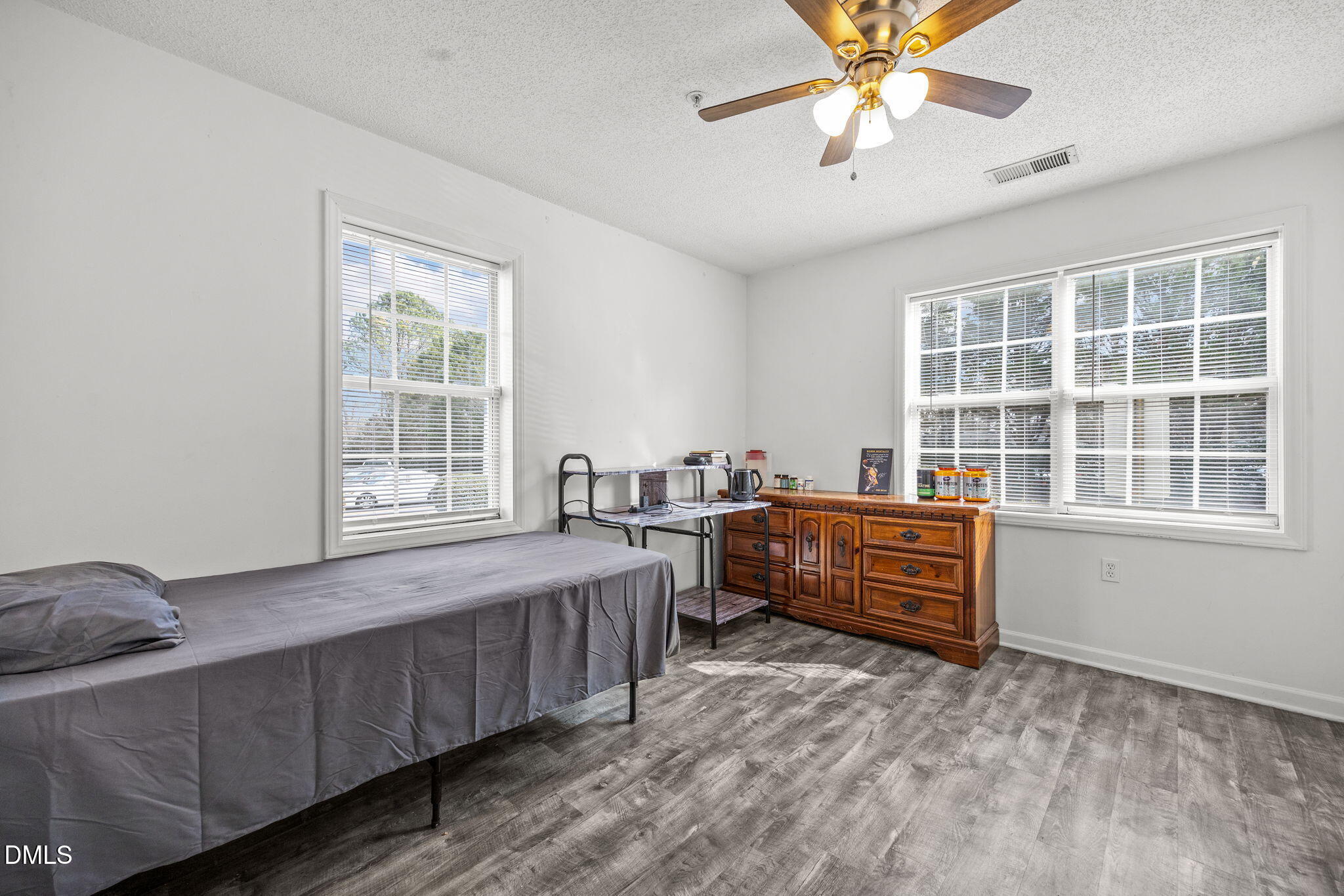 1305 Kent Road, Unit 101 Raleigh, NC 27606 - Photo 14 of 29 a bedroom with bed and window