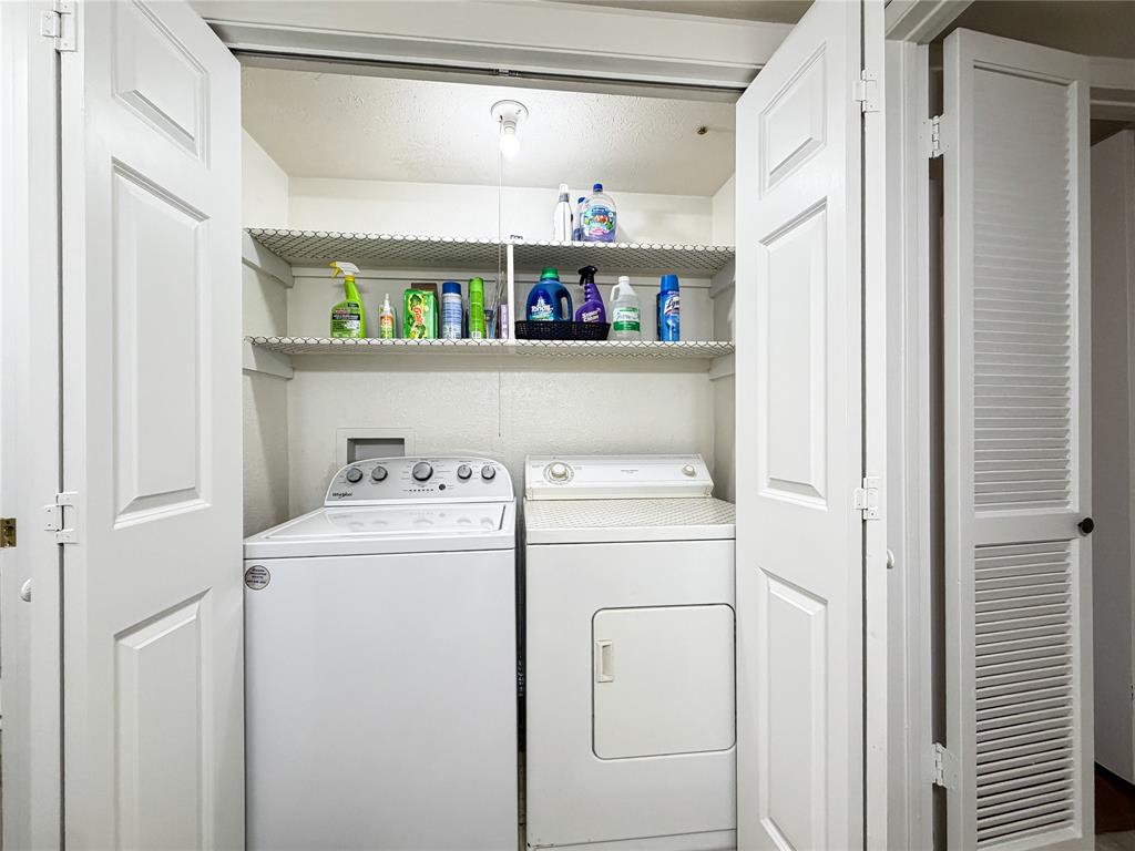 4565 North O'Connor Road, Unit 1304 Irving, TX 75062 - Photo 26 of 32 Dedicated laundry closet featuring bi-fold doors, white appliances, and integrated wire shelving
