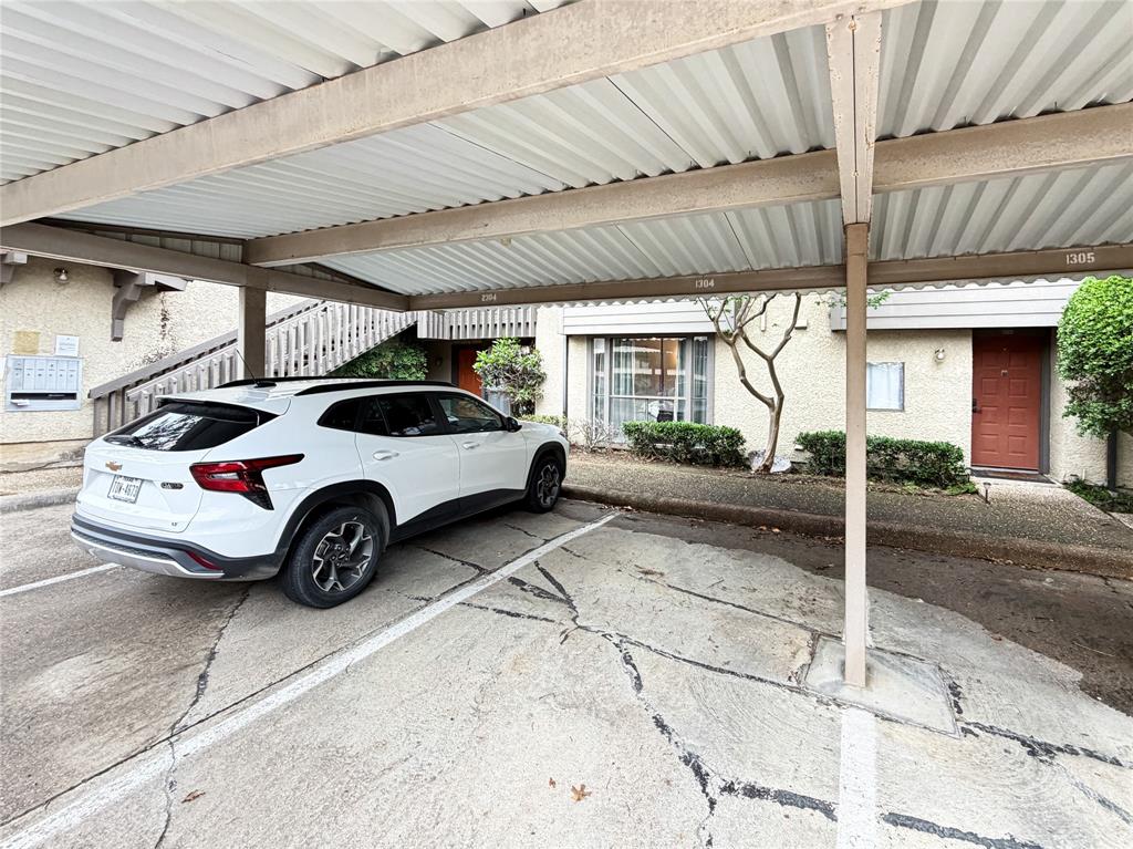 4565 North O'Connor Road, Unit 1304 Irving, TX 75062 - Photo 30 of 32 Covered parking space with adjacent building access
