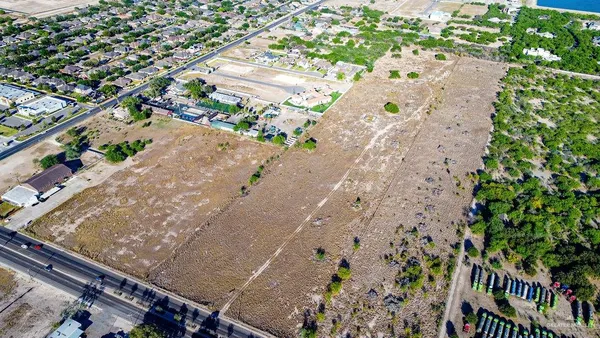 a aerial view of a house with a yard and garden view