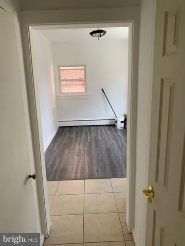 an empty room with wooden floor