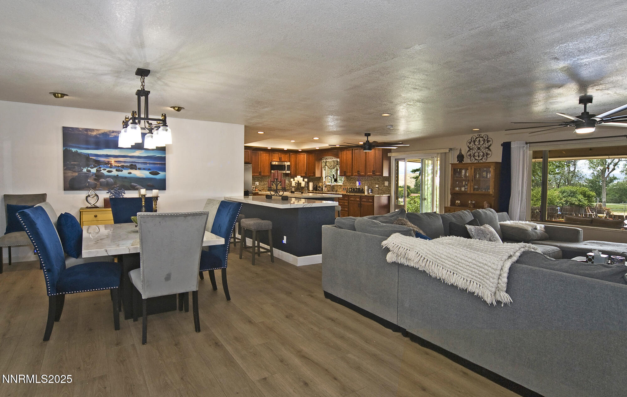5705 Blue Hills Drive Reno, NV 89502 - Photo 12 of 56 a living room with furniture and a chandelier