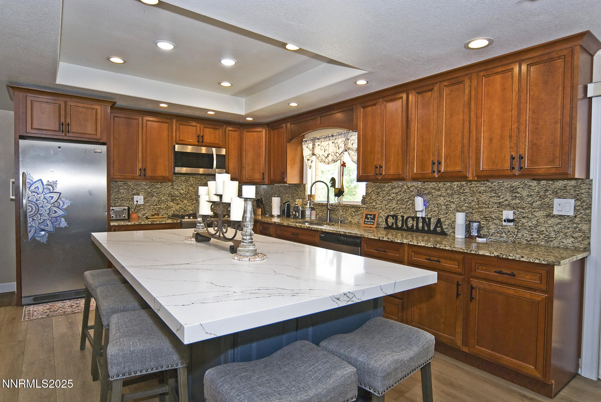 5705 Blue Hills Drive Reno, NV 89502 - Photo 15 of 56 a kitchen with a table chairs sink and cabinets