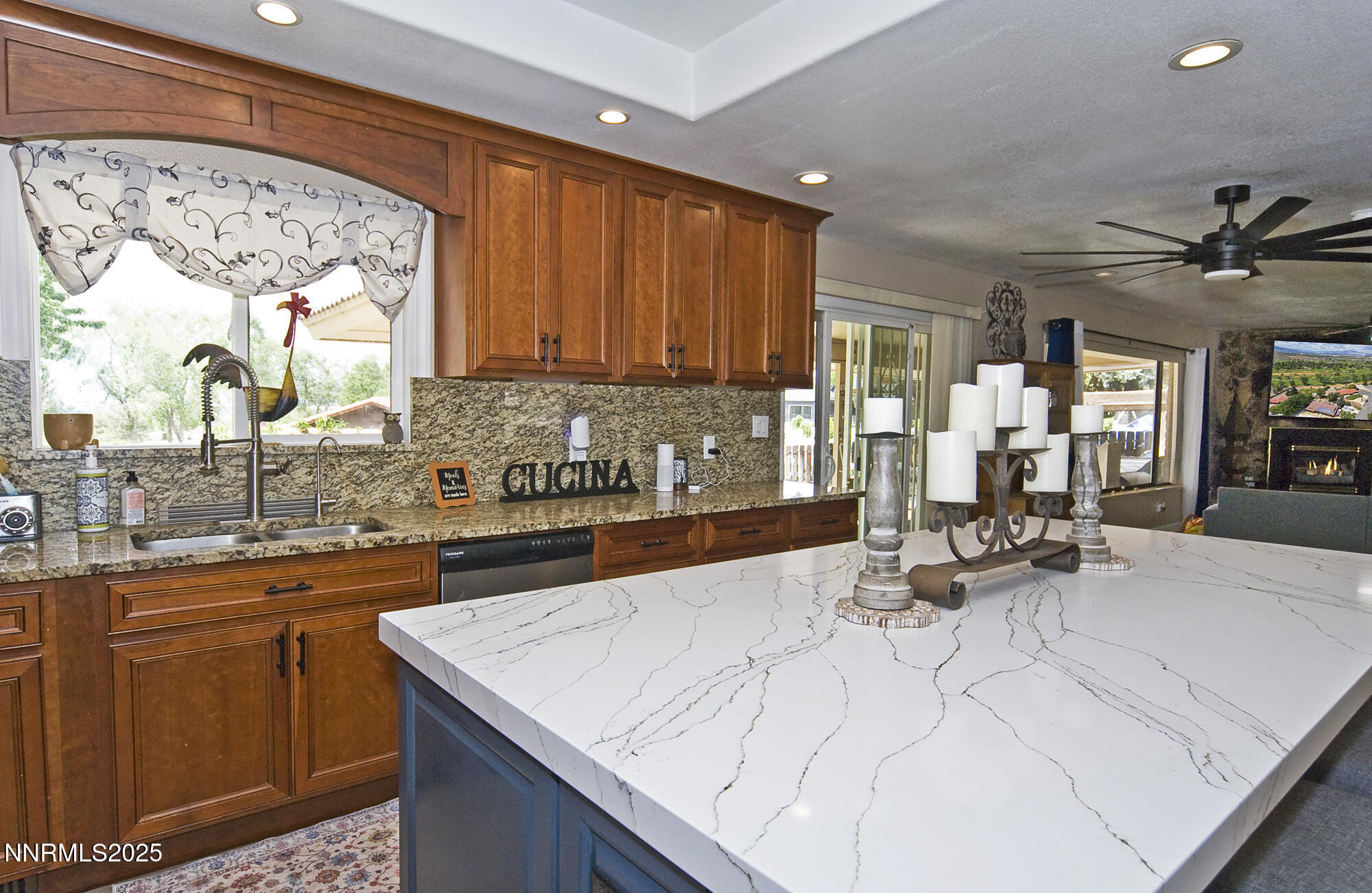 5705 Blue Hills Drive Reno, NV 89502 - Photo 19 of 56 a kitchen with stainless steel appliances kitchen island granite countertop a sink and cabinets