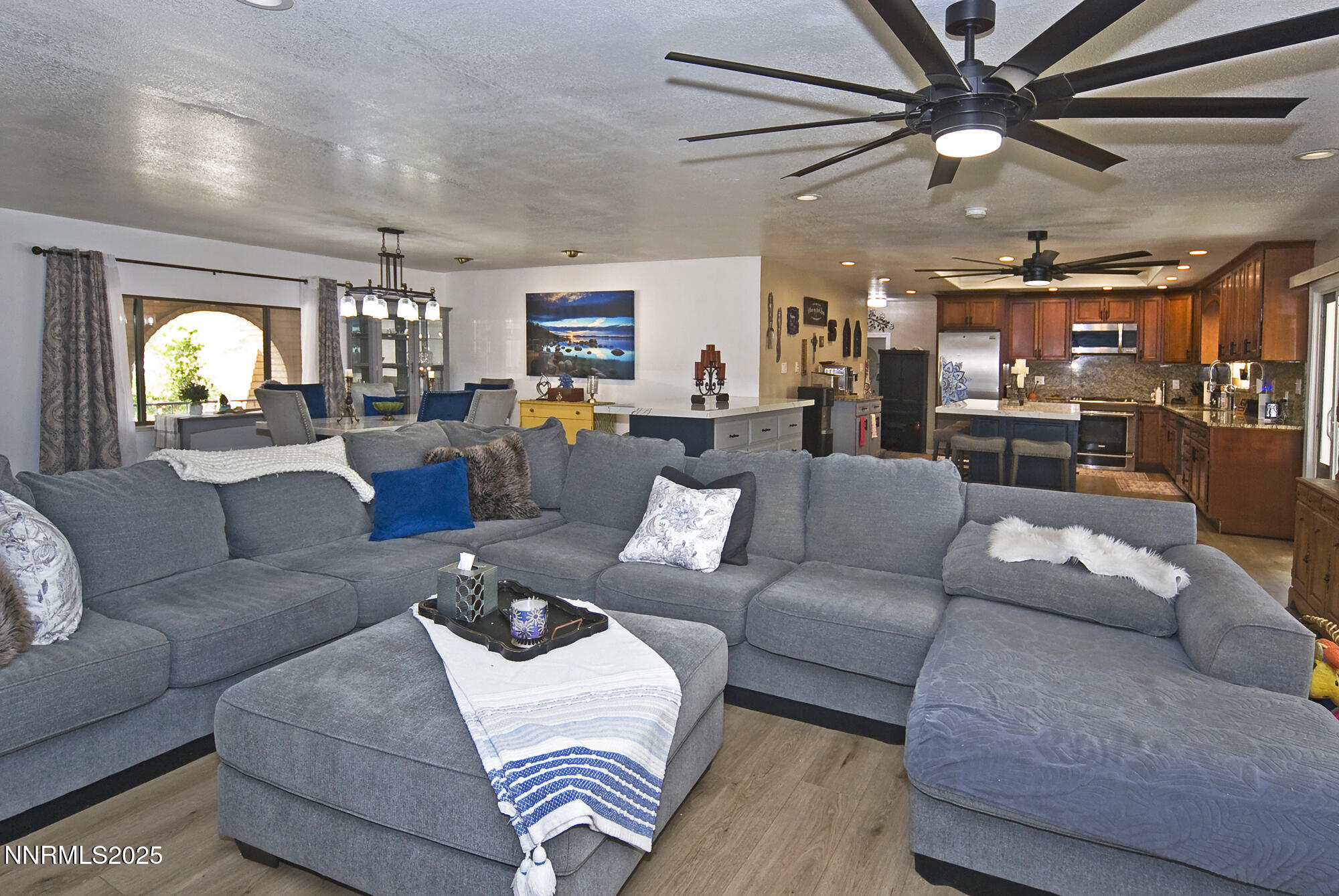5705 Blue Hills Drive Reno, NV 89502 - Photo 23 of 56 a living room with furniture and a large window