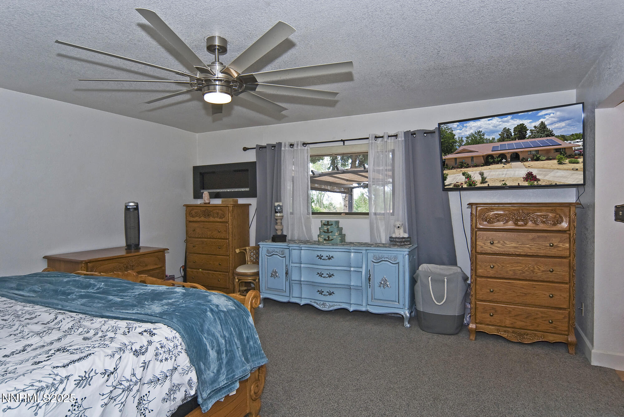 5705 Blue Hills Drive Reno, NV 89502 - Photo 24 of 56 a bedroom with a bed and a tv