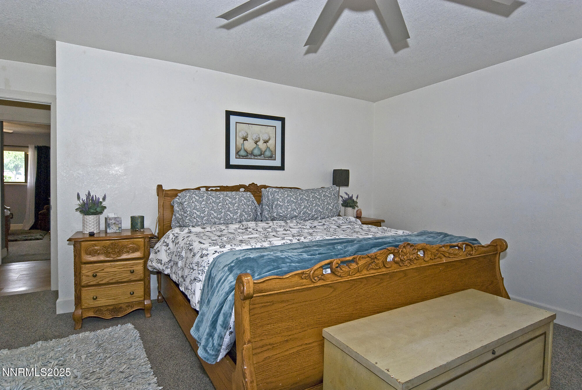 5705 Blue Hills Drive Reno, NV 89502 - Photo 25 of 56 a bedroom with a bed and a lamp on table