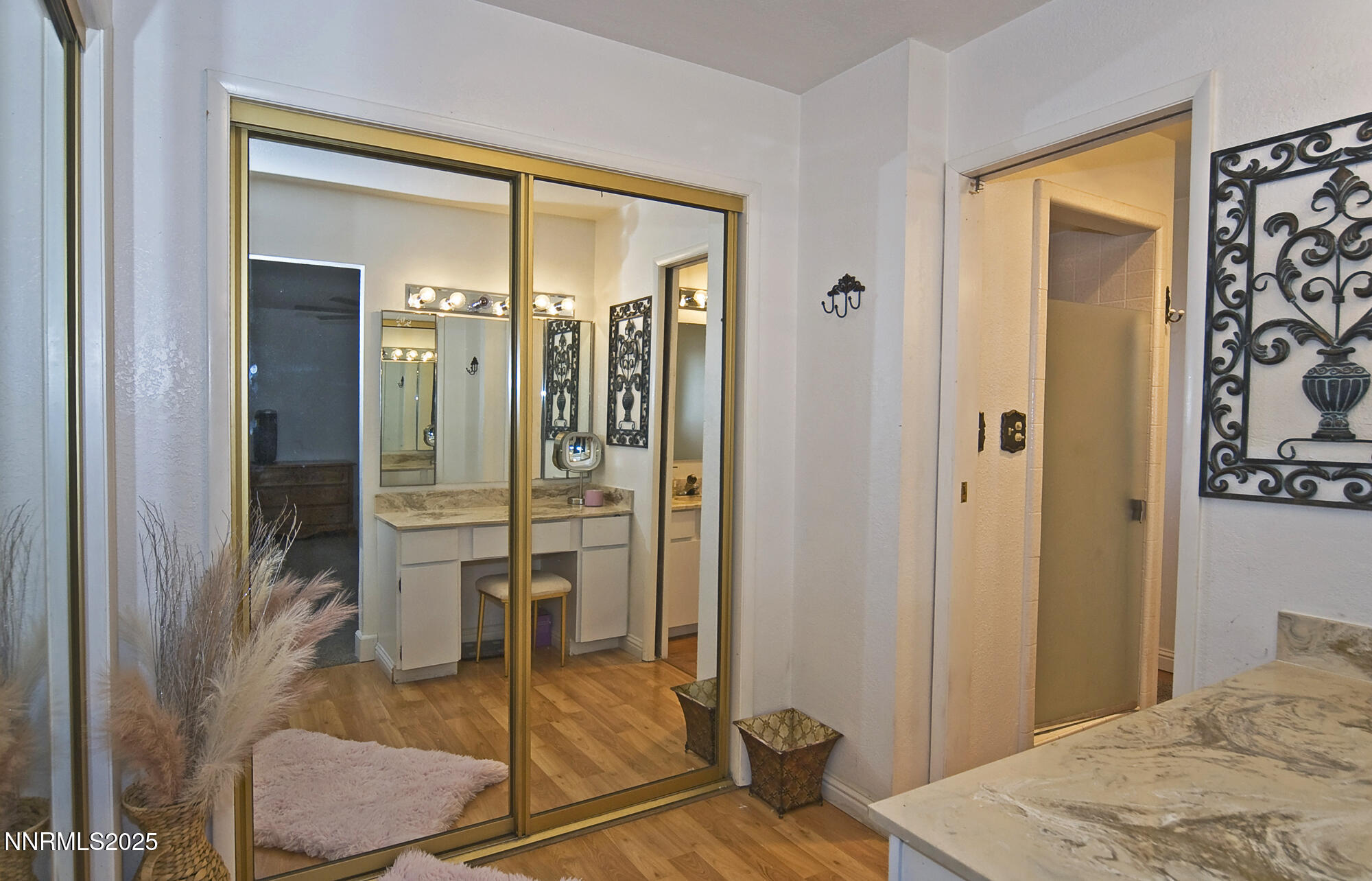 5705 Blue Hills Drive Reno, NV 89502 - Photo 27 of 56 a bedroom with a bed and a mirror