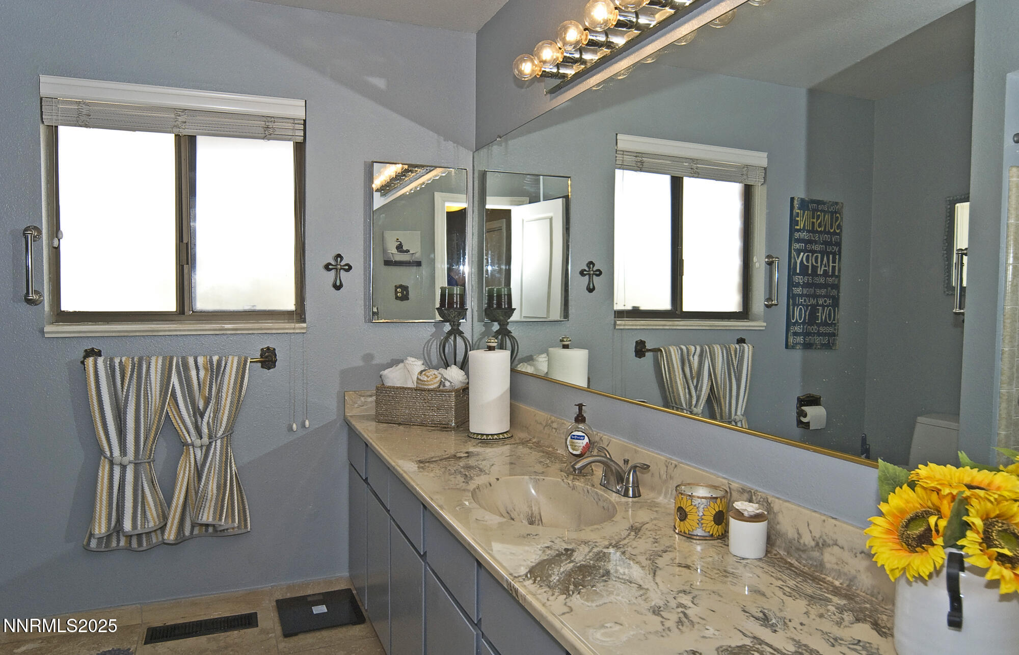 5705 Blue Hills Drive Reno, NV 89502 - Photo 30 of 56 a bathroom with a granite countertop sink and a mirror