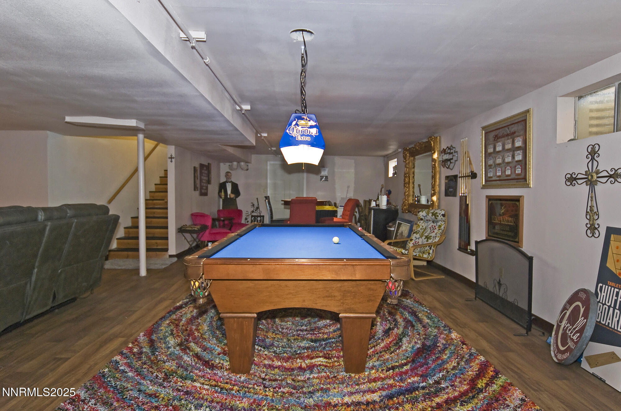 5705 Blue Hills Drive Reno, NV 89502 - Photo 33 of 56 a living room with furniture a flat screen tv and a table