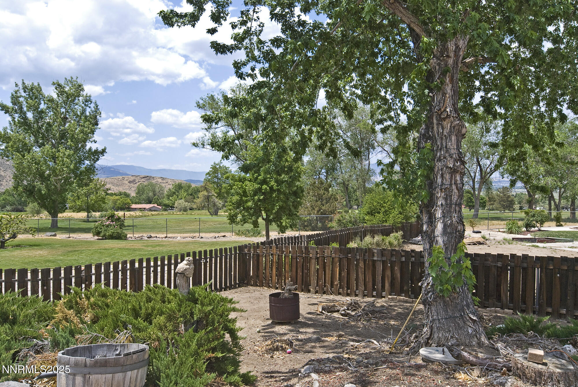 5705 Blue Hills Drive Reno, NV 89502 - Photo 40 of 56 a view of a street with a bench and trees around