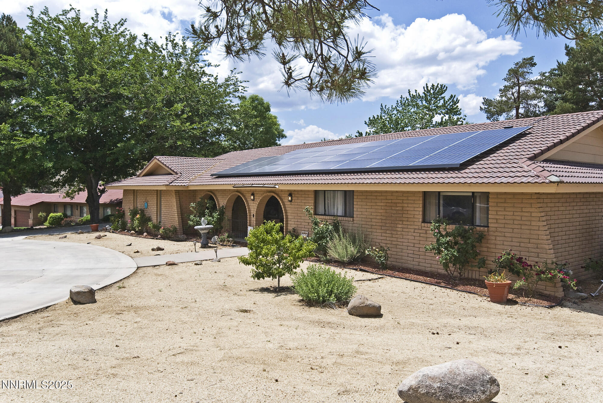 5705 Blue Hills Drive Reno, NV 89502 - Photo 4 of 56 a front view of a house with a patio