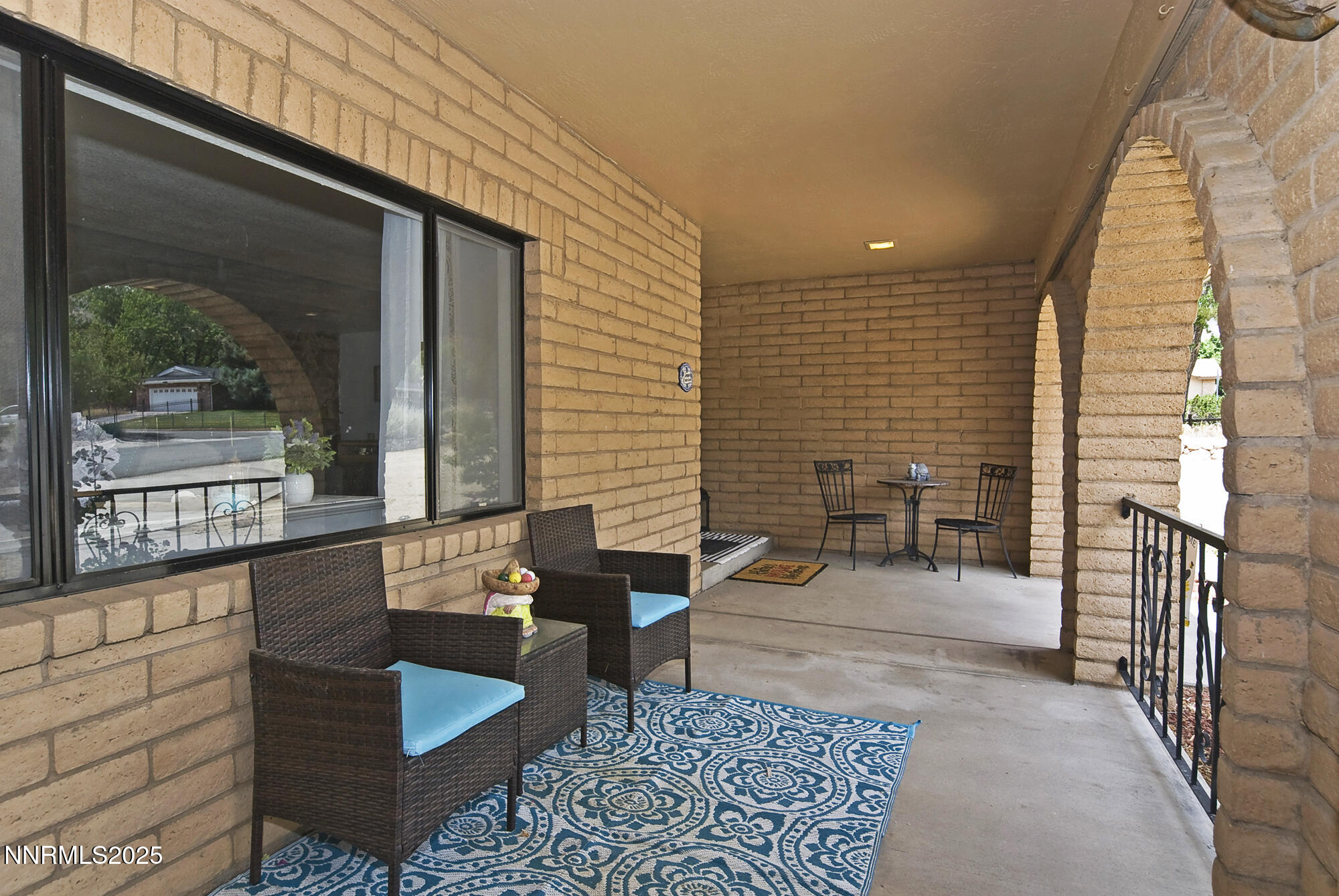 5705 Blue Hills Drive Reno, NV 89502 - Photo 9 of 56 a balcony with furniture and a potted plant