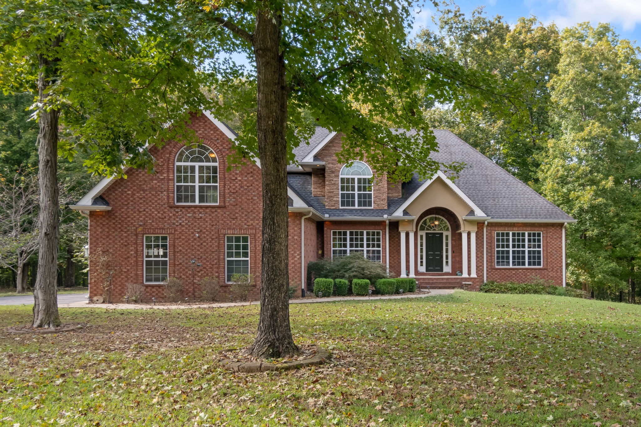 a front view of a house with a yard