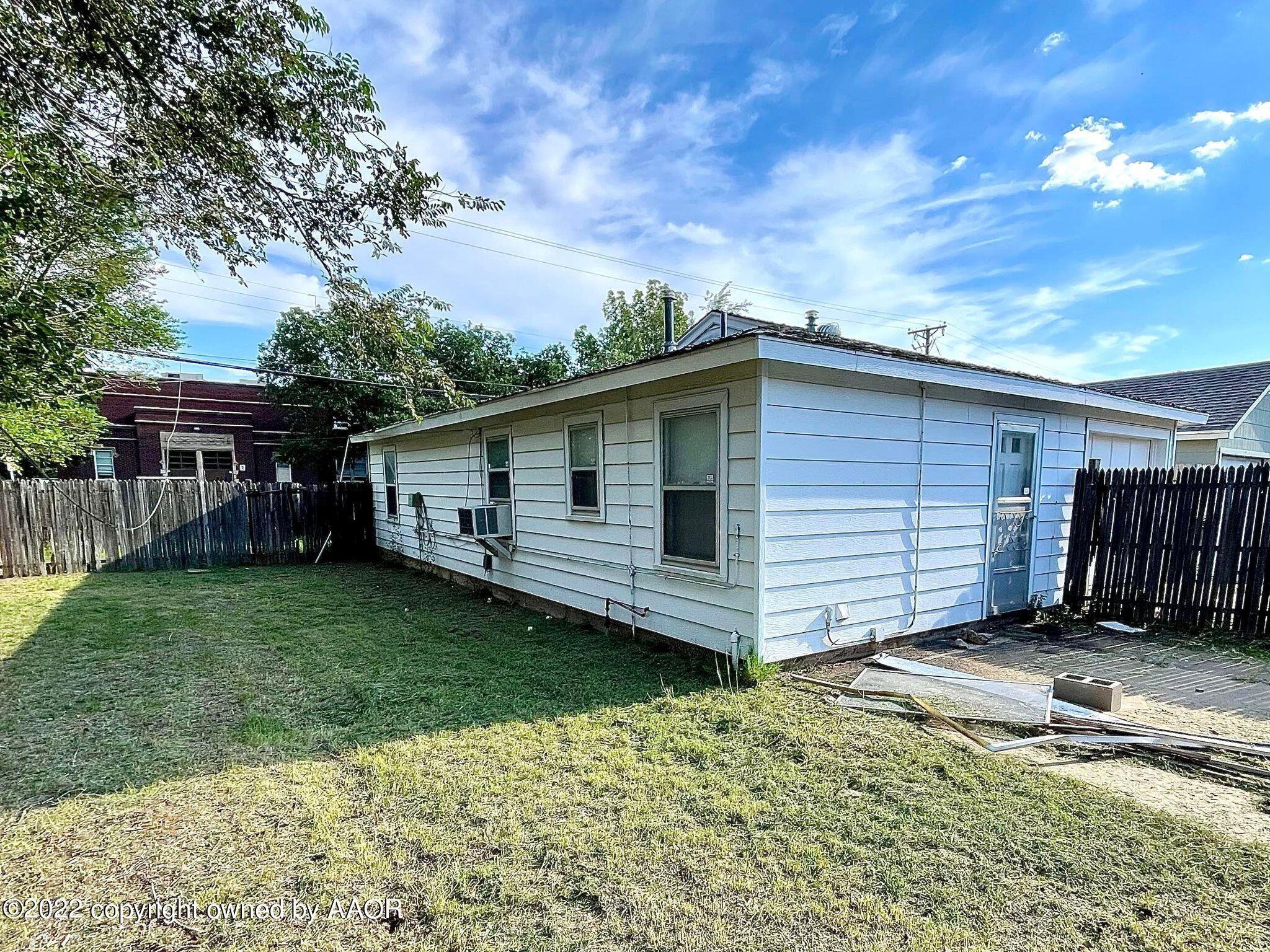 702 Sunset Terrace Amarillo, TX 79106 - Photo 15 of 21 a view of a house with backyard and garden