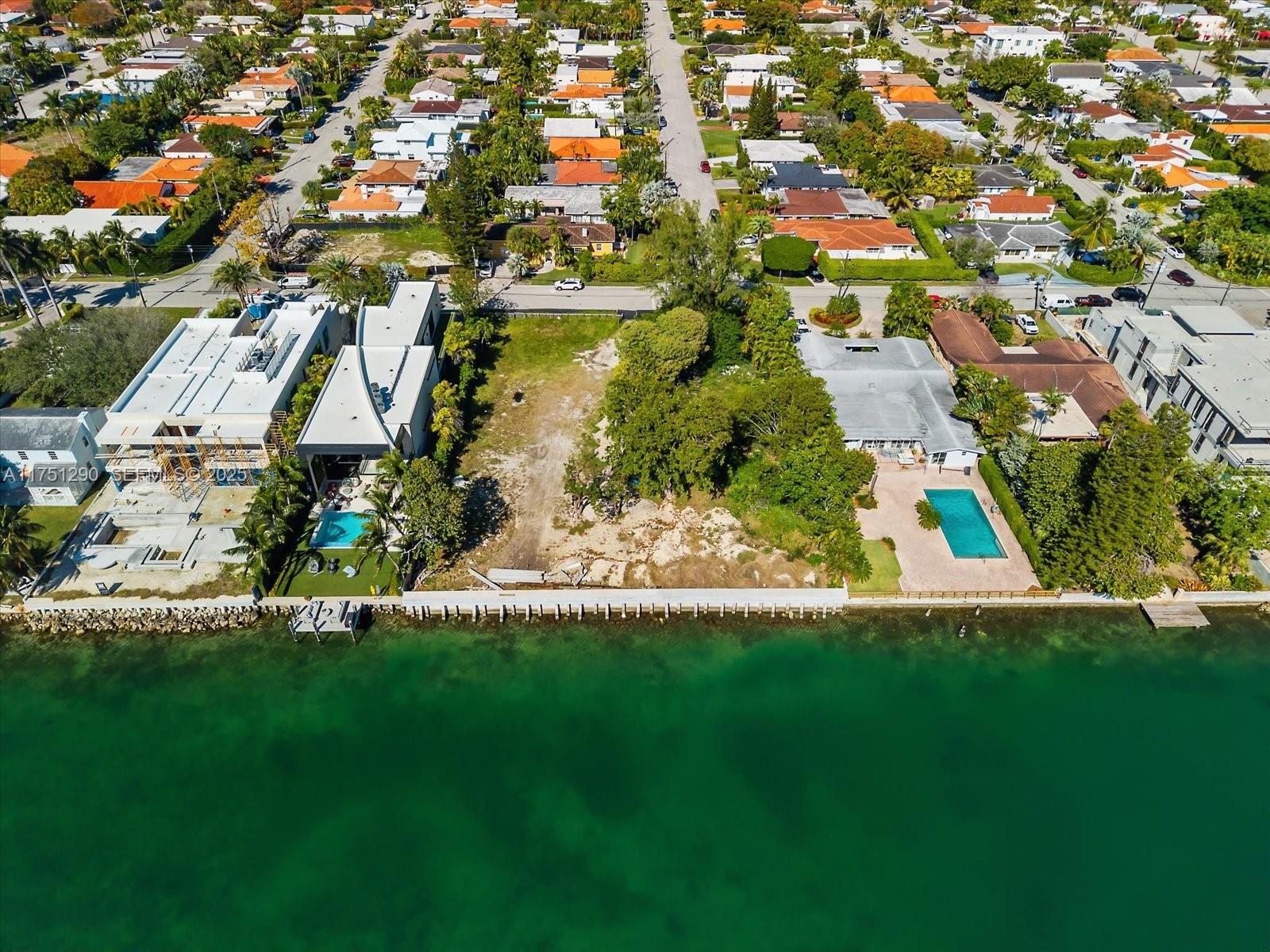 700 88th Street Surfside, FL 33154 - Photo 6 of 8 an aerial view of residential houses with outdoor space and trees
