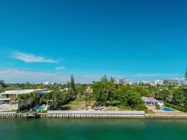 a view of residential houses with outdoor space and swimming pool