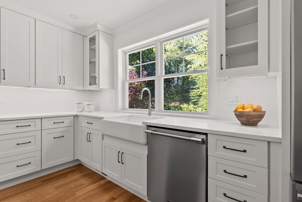 111 Killam Hill Road Boxford, MA 01921 - Photo 14 of 42 a kitchen with granite countertop white cabinets and window