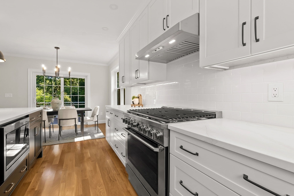 111 Killam Hill Road Boxford, MA 01921 - Photo 15 of 42 a kitchen with a stove and a wooden floors