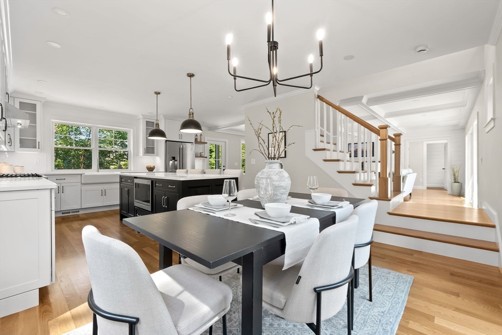 111 Killam Hill Road Boxford, MA 01921 - Photo 17 of 42 a view of a dining room with furniture window and wooden floor