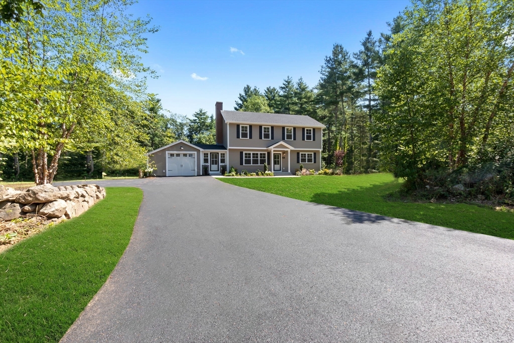 111 Killam Hill Road Boxford, MA 01921 - Photo 2 of 42 a view of a house with a big yard and large trees