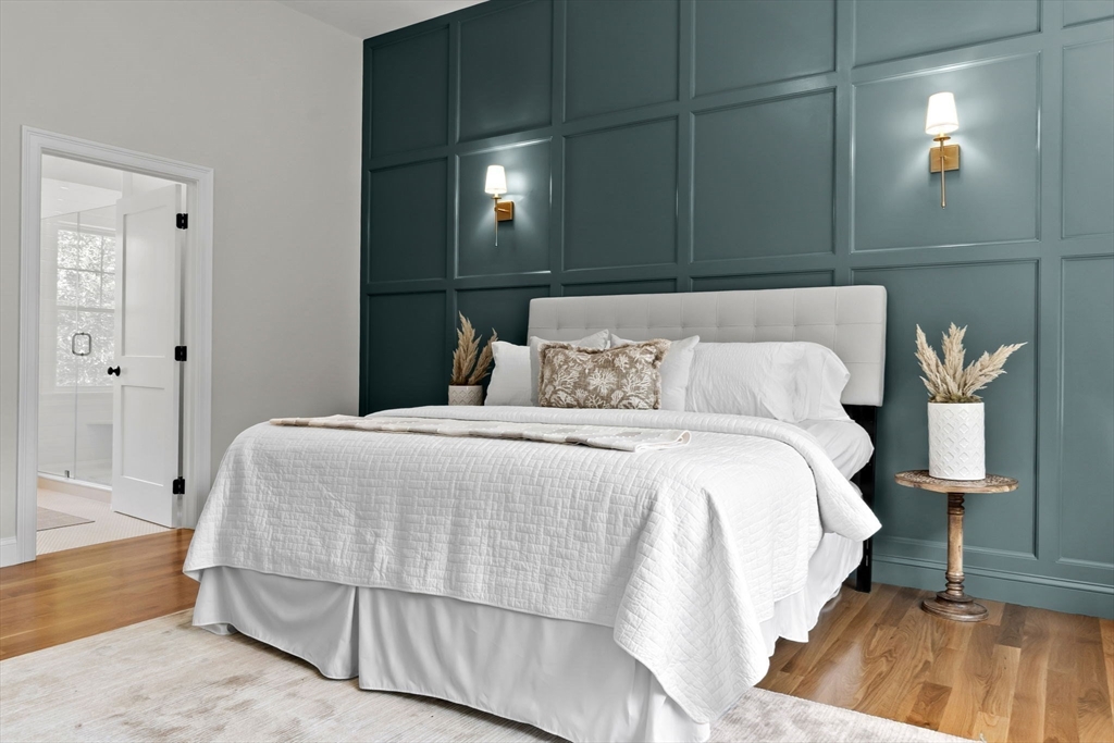 111 Killam Hill Road Boxford, MA 01921 - Photo 21 of 42 a bedroom with a bed and a lamp with the wooden floor