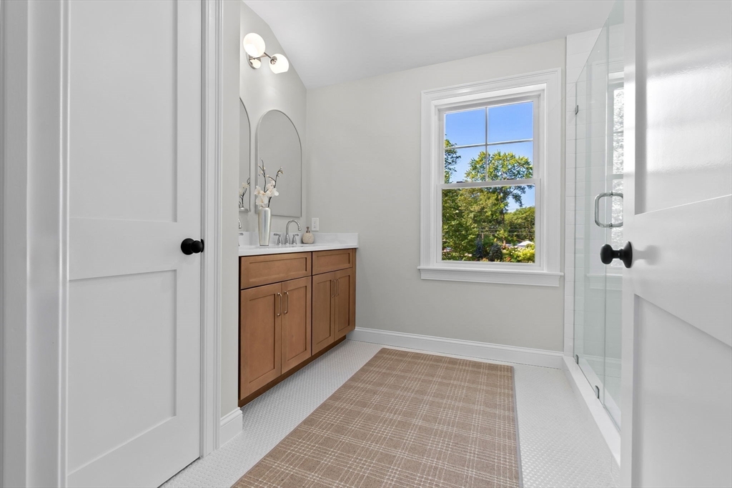 111 Killam Hill Road Boxford, MA 01921 - Photo 22 of 42 a bathroom with a sink a toilet and mirror