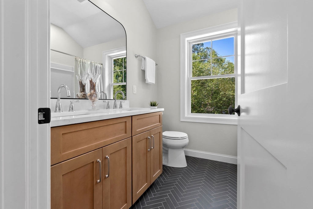 111 Killam Hill Road Boxford, MA 01921 - Photo 27 of 42 a bathroom with a toilet sink and window