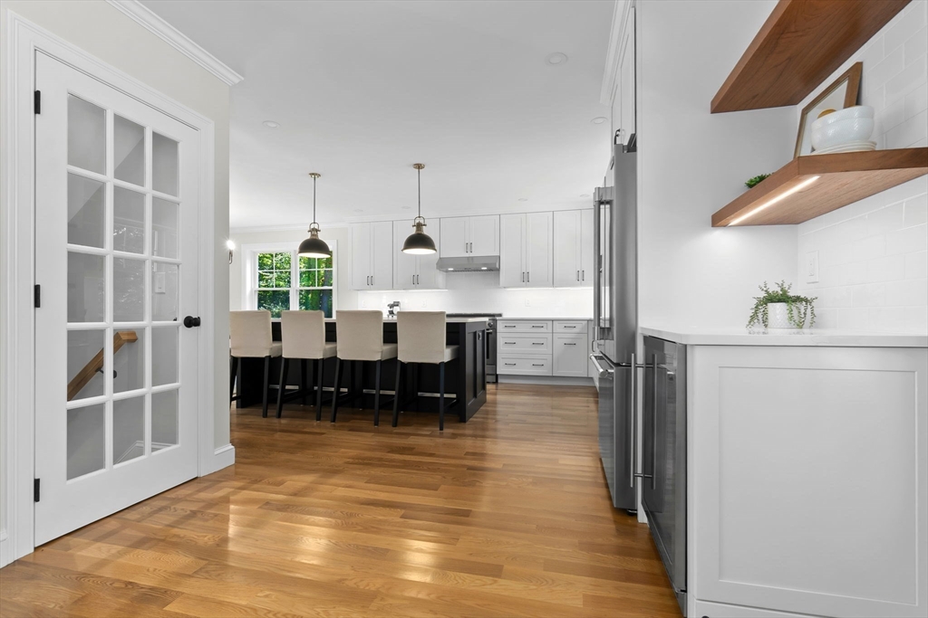 111 Killam Hill Road Boxford, MA 01921 - Photo 31 of 42 a living room with stainless steel appliances kitchen island granite countertop furniture and a kitchen view