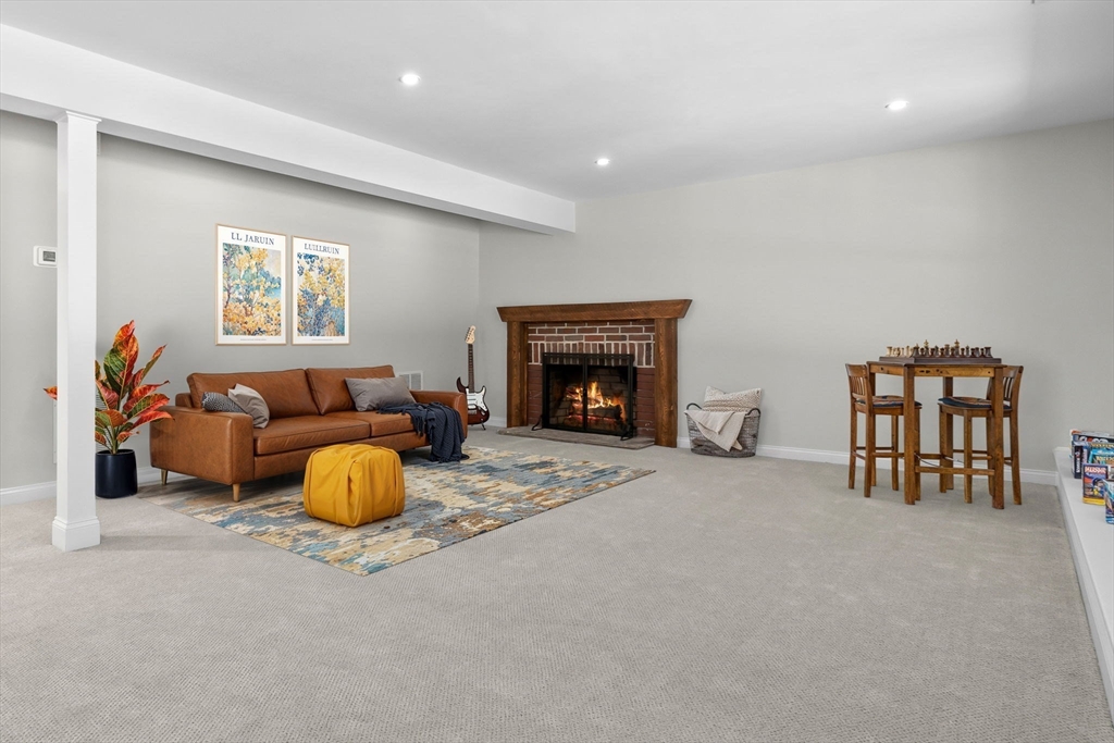 111 Killam Hill Road Boxford, MA 01921 - Photo 32 of 42 a living room with furniture and a fireplace